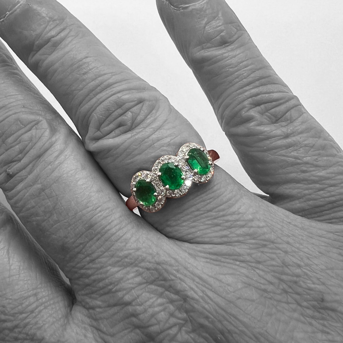 18kw Emerald and Diamond Halo Ring