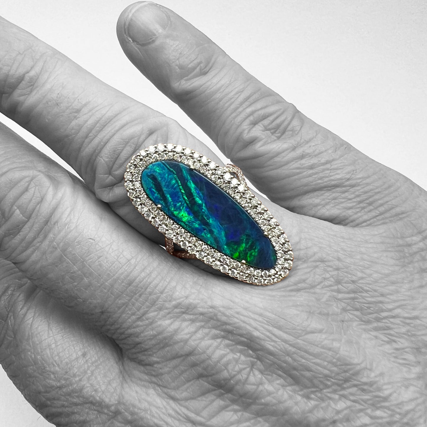 18kw Opal and Diamond Halo Ring