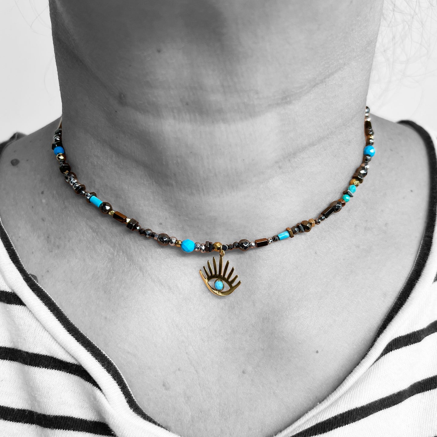 18ky Evil Eye Pendant on beaded necklace